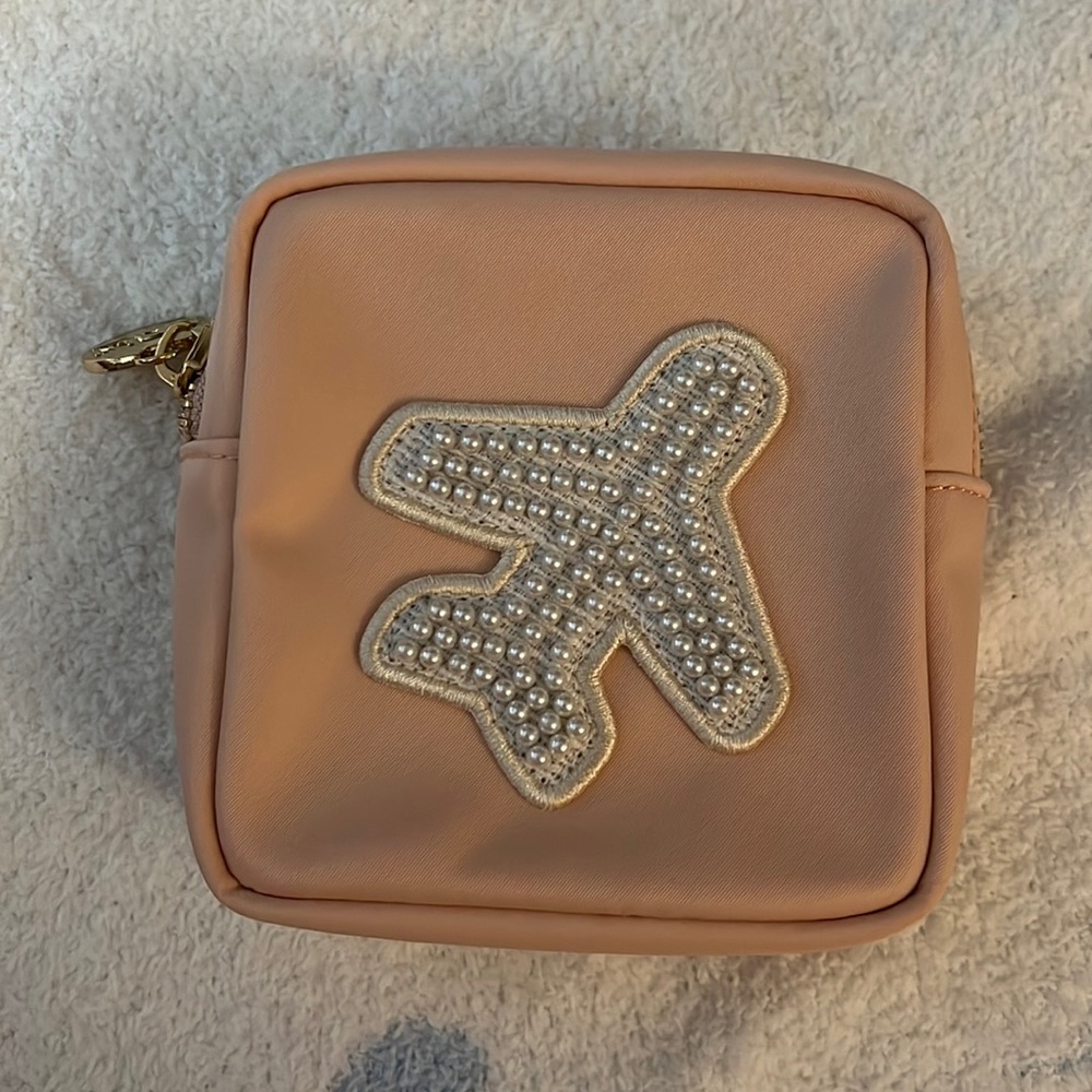 stoney clover lane sparkling cider mini pouch with pearl plane